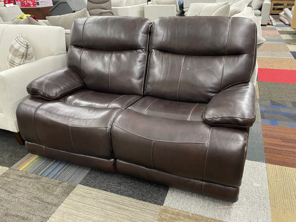 Brown leather love seat