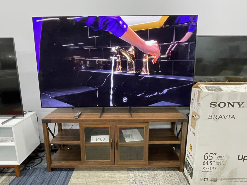 Wood TV console with 4 shelves and 2 glass doors