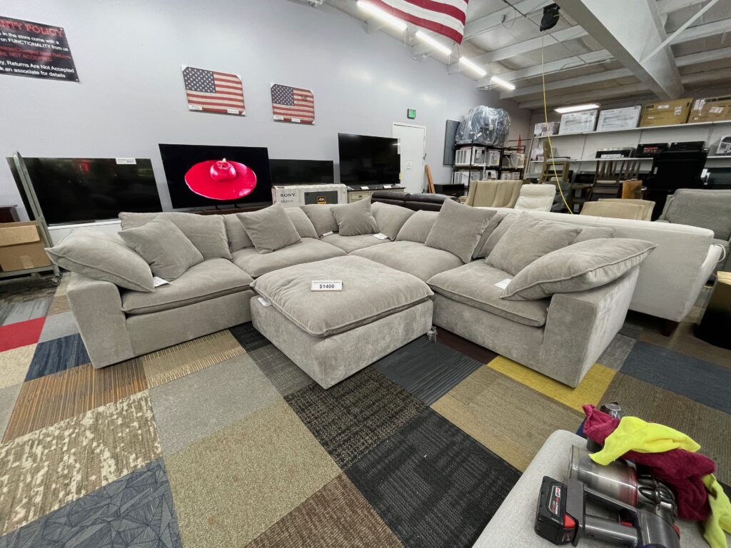 Cream tone fabric sectional with ottoman